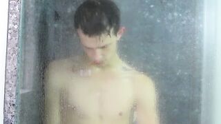 Tugging on his wet cock and moaning in the shower all alone