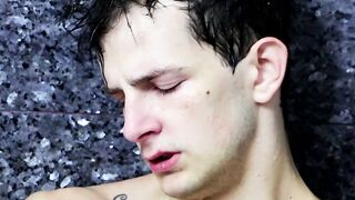 Tugging on his wet cock and moaning in the shower all alone