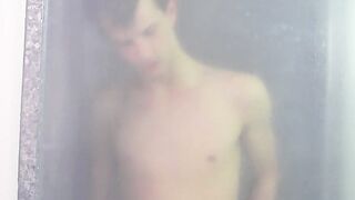 Tugging on his wet cock and moaning in the shower all alone