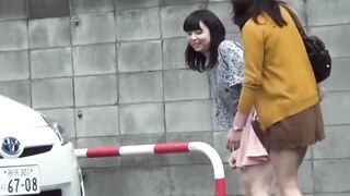 Modest Japanese young ladies are peeing in a public restroom