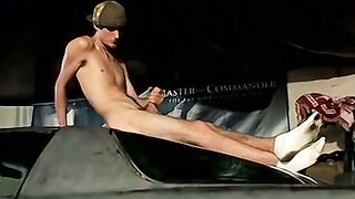 Expensive car with thug stroking his cock on top of it
