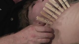 Master punishing his young sub with dozens of clothespins
