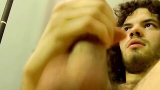 Solo amateur stud wanks off his hard cock and cums
