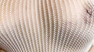 Dark Haired into a fishnet having fun with her slit