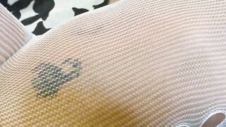 Dark Haired into a fishnet having fun with her slit