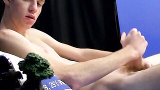 Cutie jerks off on the bed with a big dildo deep inside him