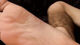 Big dick Wiley has his cum dribbling down those soles after wanking
