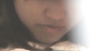 Cute Asian babe filmed by horny voyeur during masturbation