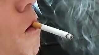Blonde twink revealed his cock while blowing smoke
