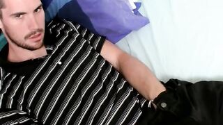 Hairy dick Hunter relaxing on the bed and wanking it hard