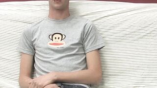 Adorable gay guy Danny jerks off his dick on couch solo