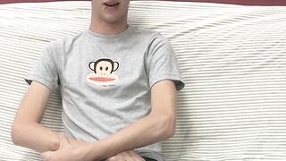 Adorable gay guy Danny jerks off his dick on couch solo
