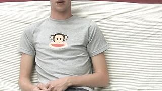 Adorable gay guy Danny jerks off his dick on couch solo