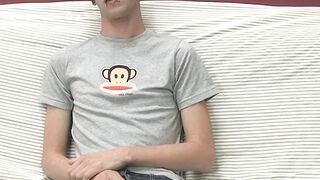 Adorable gay guy Danny jerks off his dick on couch solo
