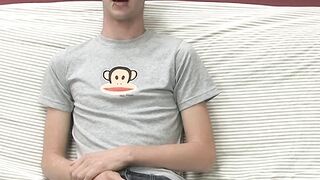 Adorable gay guy Danny jerks off his dick on couch solo