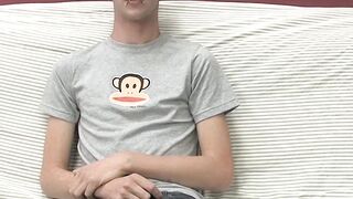 Adorable gay guy Danny jerks off his dick on couch solo