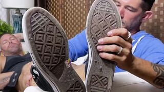 Kinky tattooed stud moans during passionate foot licking