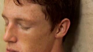 Redhead twink Alan Parish masturbates and cums under shower