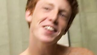 Redhead twink Alan Parish masturbates and cums under shower