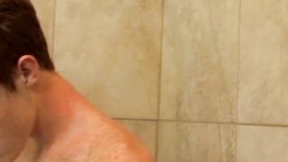 Redhead twink Alan Parish masturbates and cums under shower