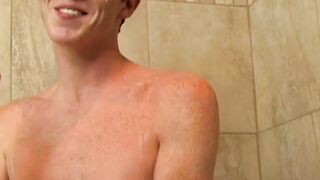 Redhead twink Alan Parish masturbates and cums under shower