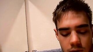 Horny Zack Randall strips off in the bathroom before rubbing his cock