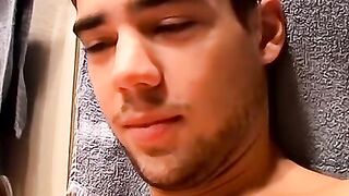 Horny Zack Randall strips off in the bathroom before rubbing his cock