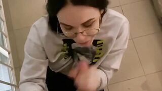 Nerdy beauty blows penis on parking lot