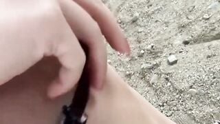 Little Japanese babe peeing while fingered in public