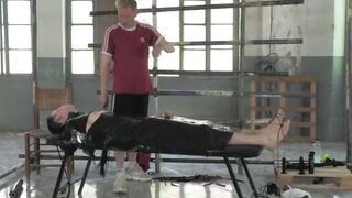 The handsome sub feels pleasure from the kinky footplay his master Ashton Bradley giv