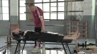 The handsome sub feels pleasure from the kinky footplay his master Ashton Bradley giv