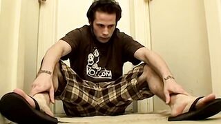 Stunning Nailz shows off his hairy ass before shooting his cum over his naked feet