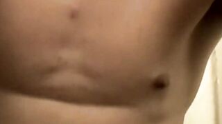 Stunning Nailz shows off his hairy ass before shooting his cum over his naked feet