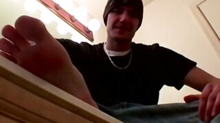 Handsome Clyde takes off his shoes to worship his foot before masturbating