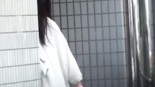 NipponPissTV.com - Young Asian chick chats on phone while pissing freely