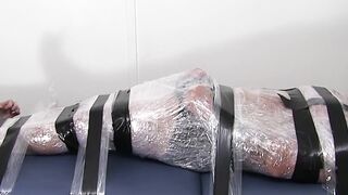 Restrained hunk endures tickling torment from his dom
