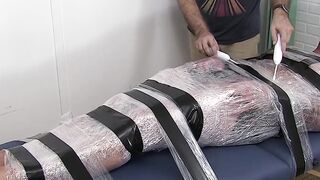 Restrained hunk endures tickling torment from his dom