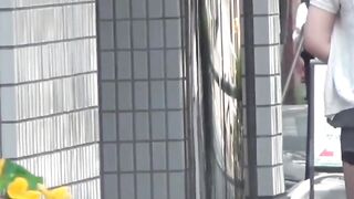 NipponPissTV.com - Japanese brunette squats and pisses freely outdoors in public
