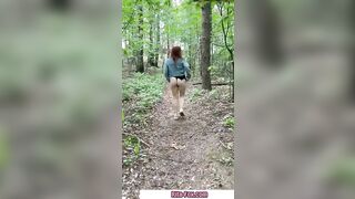 Bombshell redheaded snatch walks through the woods almost nude