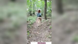 Bombshell redheaded snatch walks through the woods almost nude