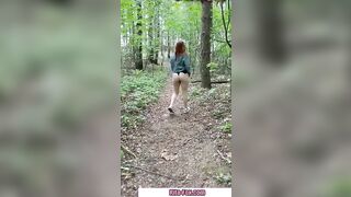 Bombshell redheaded snatch walks through the woods almost nude