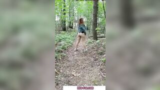 Bombshell redheaded snatch walks through the woods almost nude