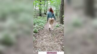 Bombshell redheaded snatch walks through the woods almost nude