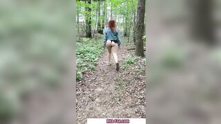 Bombshell redheaded snatch walks through the woods almost nude