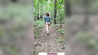Bombshell redheaded snatch walks through the woods almost nude