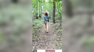 Bombshell redheaded snatch walks through the woods almost nude
