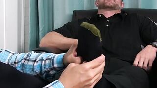 Tattooed hunk enjoys while having his toes licked and sucked