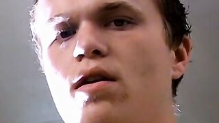 Tattooed Holden pullout cock and shoots load on his chest while blowing smoke