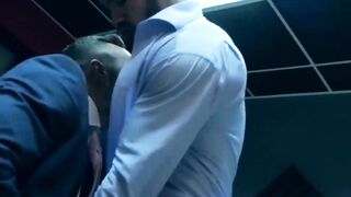 PlayingMen.com - Elegant hunk wears slick blue suit while ramming hot stud deeply and