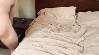 Hairy dude Elliot Finn jumps up and down a big brown dildo